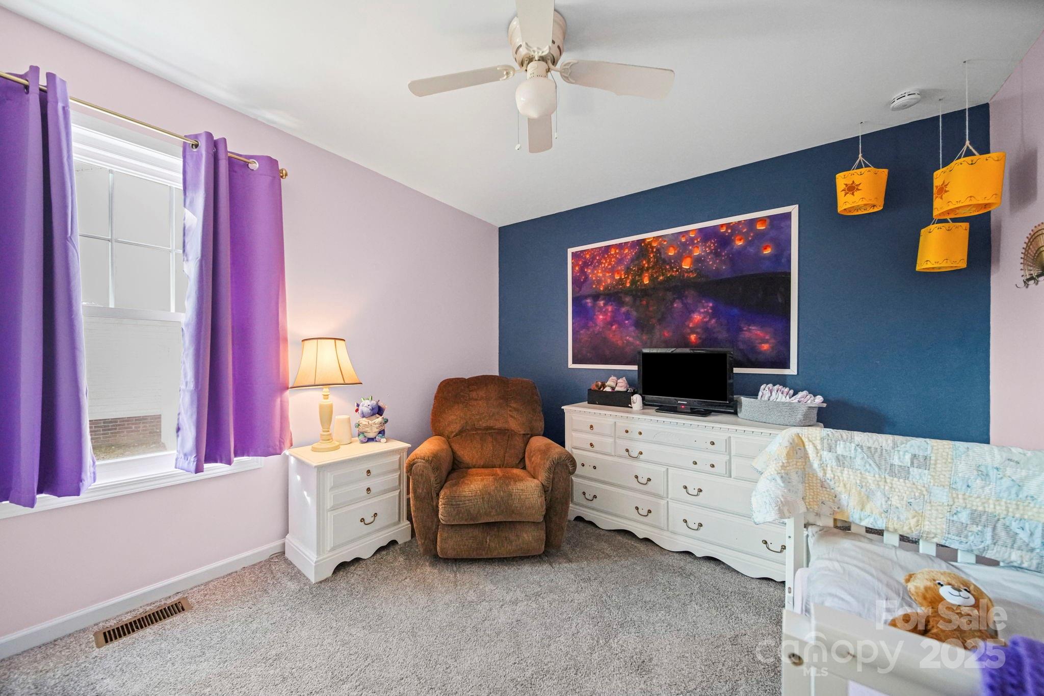 620 Pleasant Avenue Kannapolis, NC 28081 - Photo 12 of 24 a living room with furniture and a flat screen tv