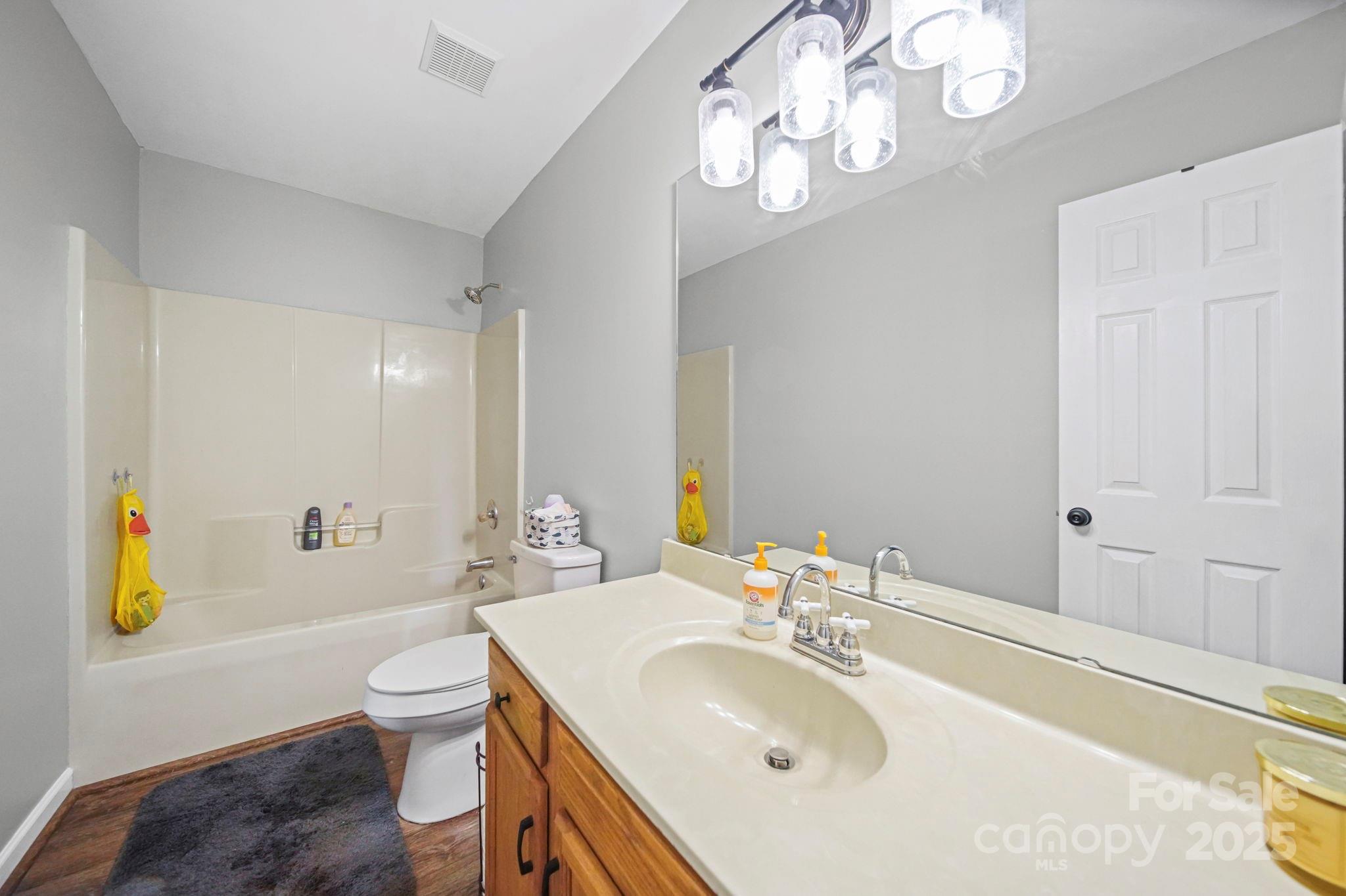 620 Pleasant Avenue Kannapolis, NC 28081 - Photo 14 of 24 a bathroom with a sink a toilet and bathtub