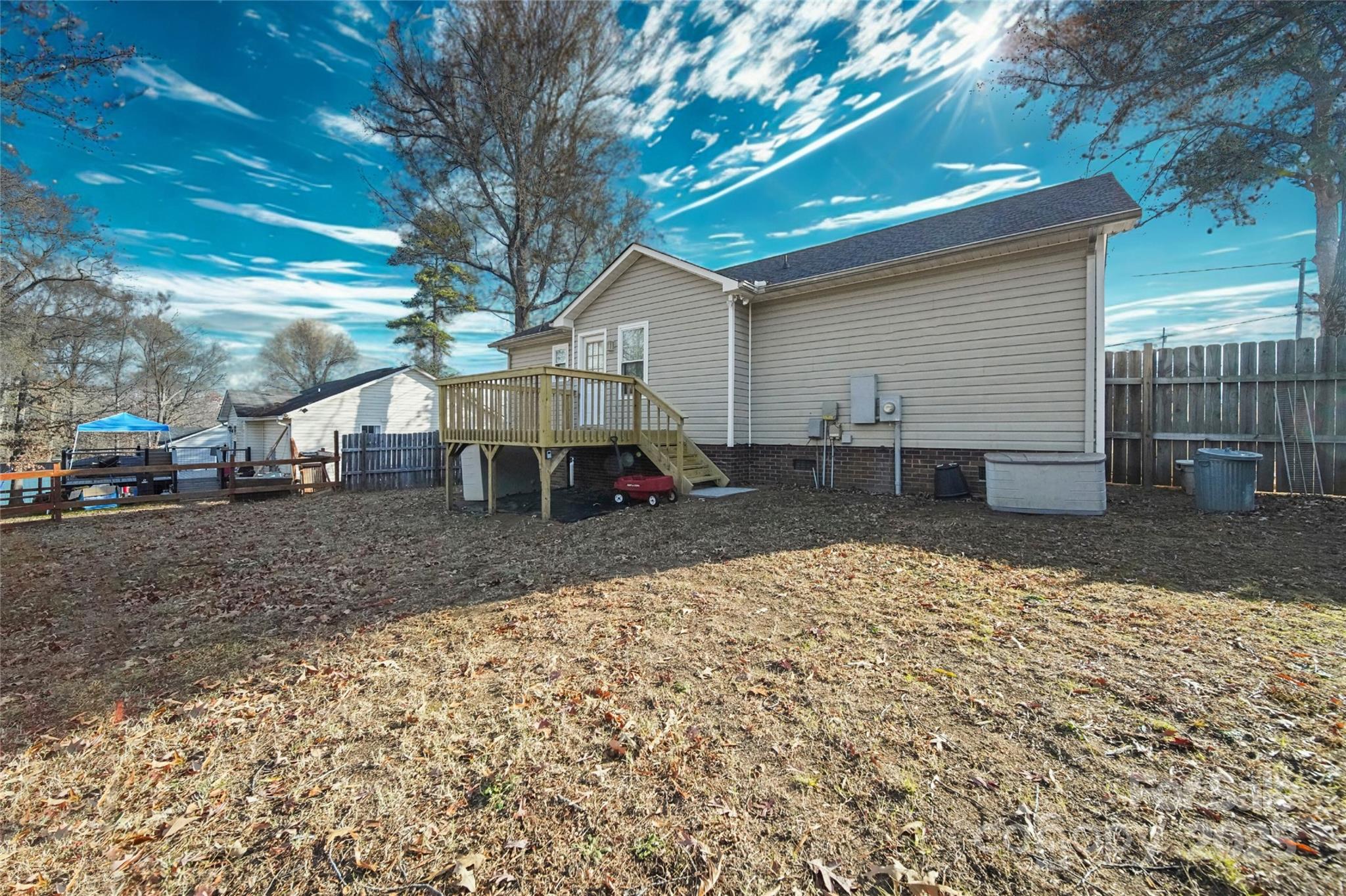 620 Pleasant Avenue Kannapolis, NC 28081 - Photo 21 of 24 a view of a backyard with table and chairs under an umbrella