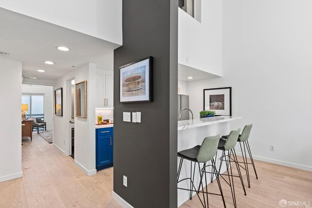 a view of a hallway with seating area