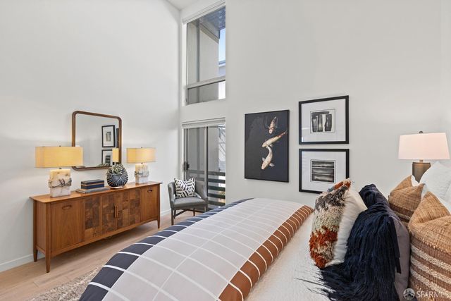 a bed room with a bed and a tv