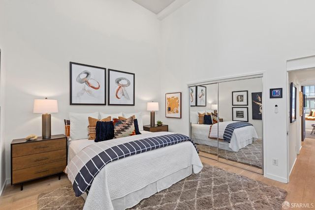 a bedroom with a bed and a couch