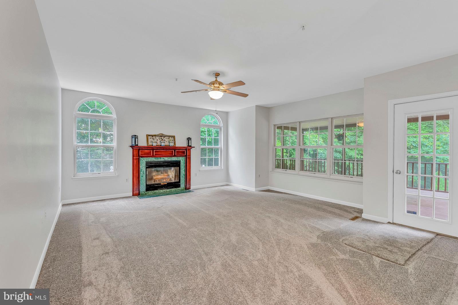 701 Small Reward Road Huntingtown, MD 20639 - Photo 29 of 63 Family room with screened in porch attached