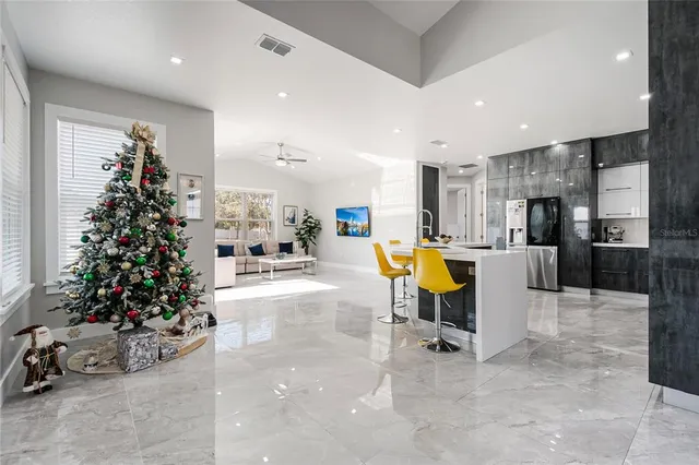 a view of a living room a dining room with furniture