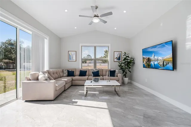 a living room with furniture and a large window