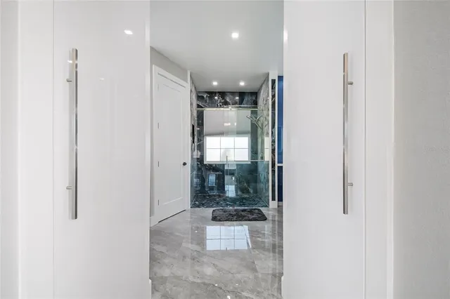 a bathroom with a glass shower door