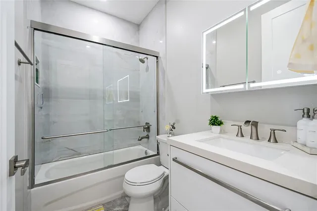 a bedroom with a bed and a mirror