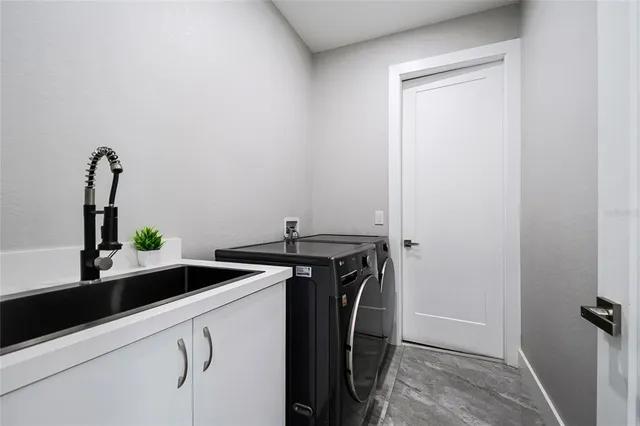 a front view of a house with a garden and yard