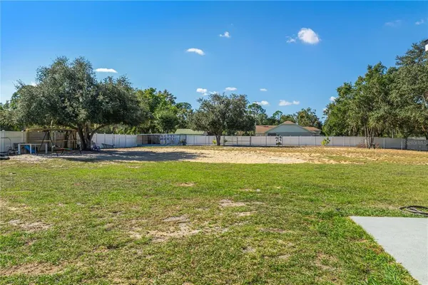 a view of a backyard of the house