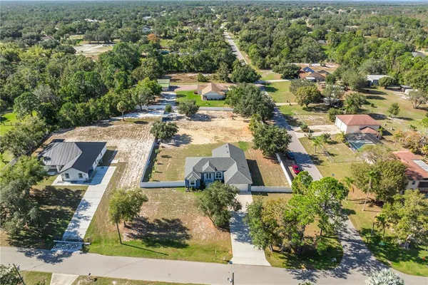 a aerial view of a house with a yard