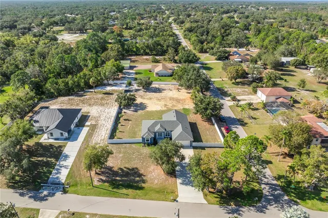 a aerial view of a house with a yard