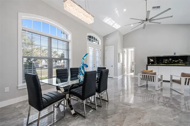 a view of a dining room with furniture window and outside view