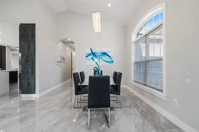 a dining room with furniture and window