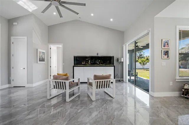 a view of a dining room with furniture and a window