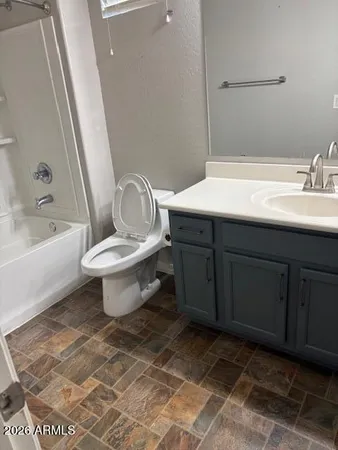 a bathroom with a sink toilet and bathtub