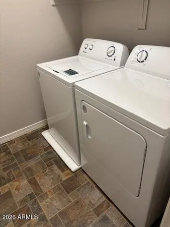 a utility room with dryer and washer