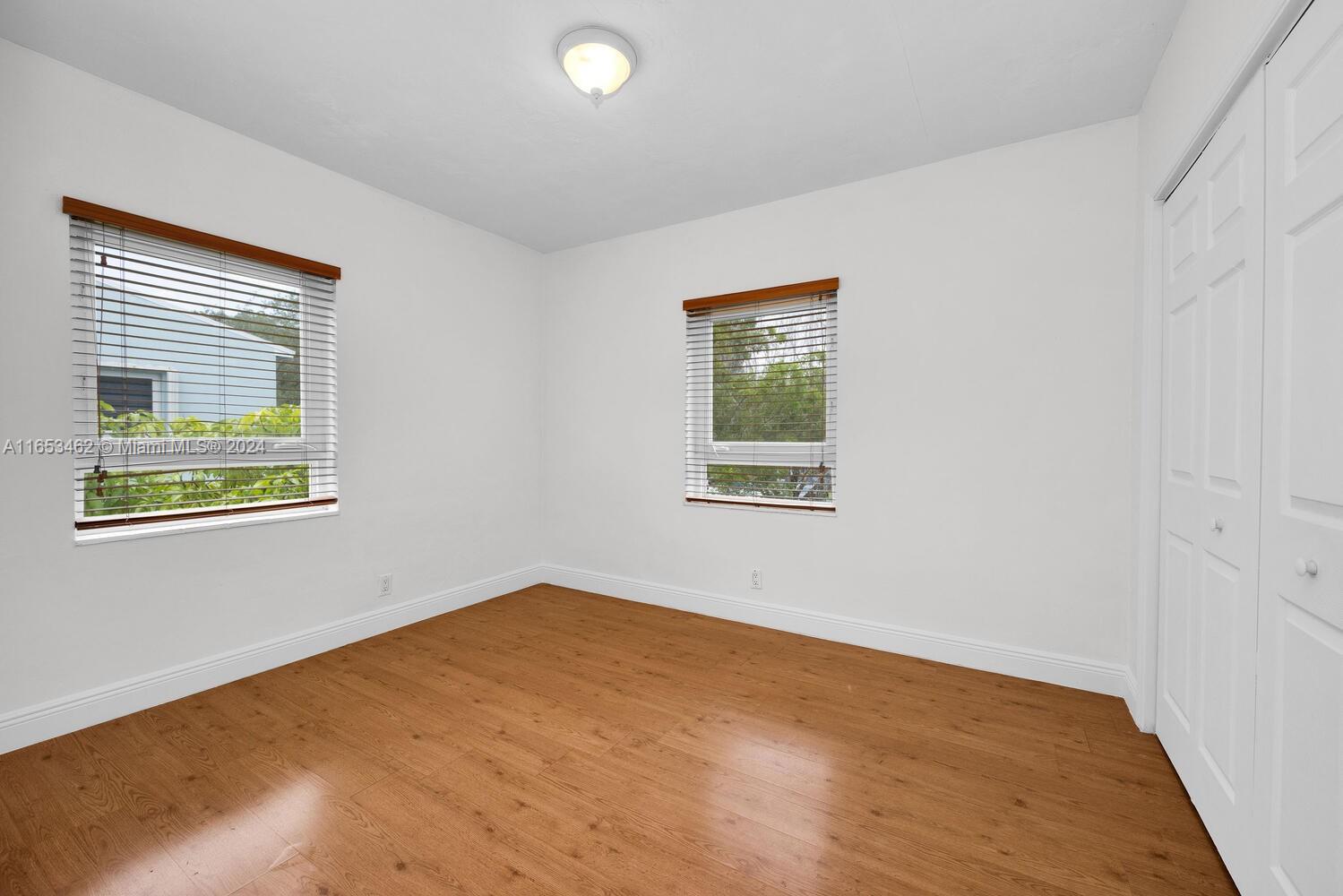 5630 Southwest 76th Street, Unit 3 Miami, FL 33143 - Photo 12 of 16 a view of an empty room with a window