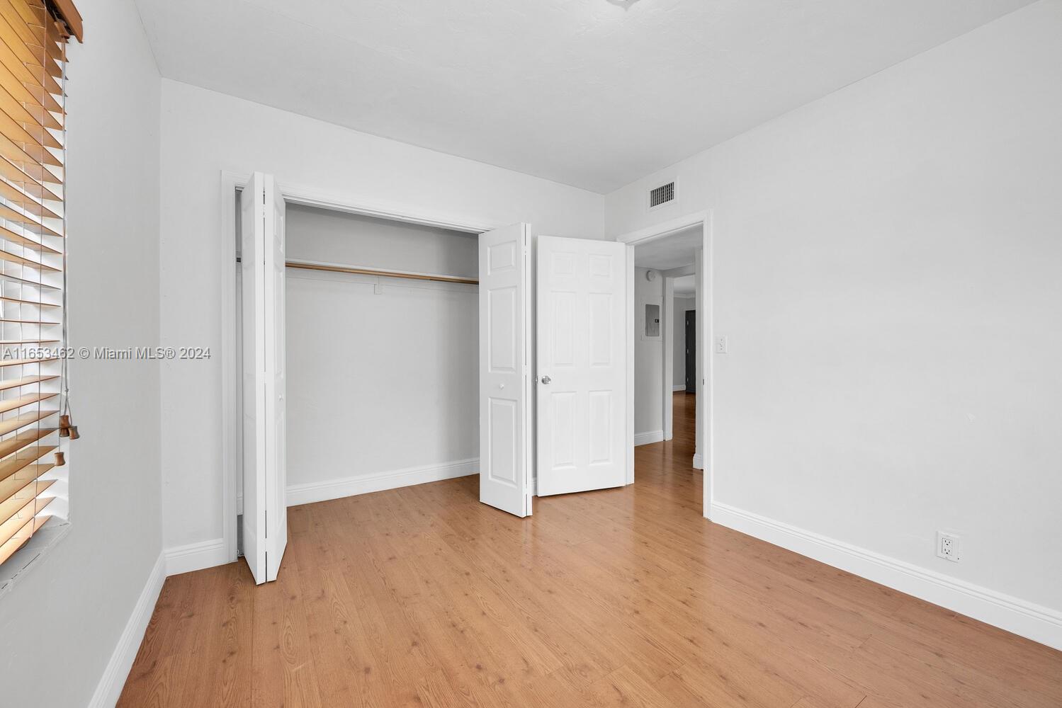 5630 Southwest 76th Street, Unit 3 Miami, FL 33143 - Photo 13 of 16 wooden floor in an empty room