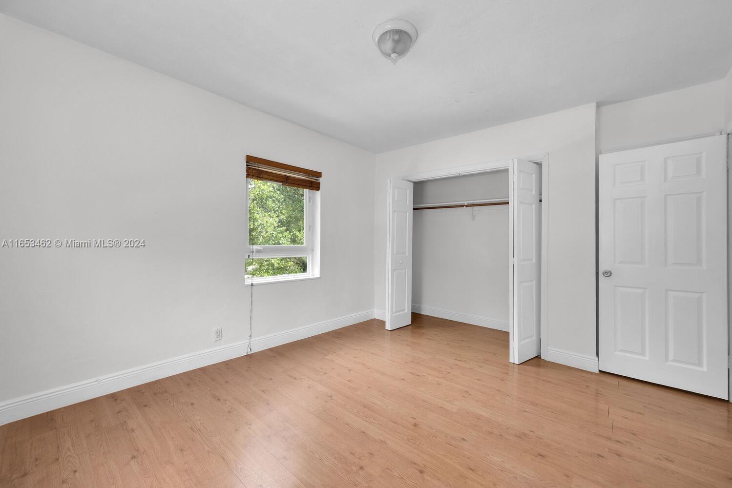 5630 Southwest 76th Street, Unit 3 Miami, FL 33143 - Photo 16 of 16 a view of an empty room with a window