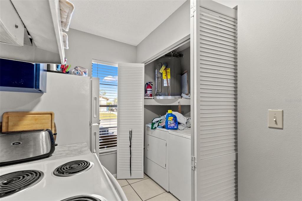 7124 Barclay Avenue, Unit A Spring Hill, FL 34609 - Photo 10 of 22 a room with storage and utility