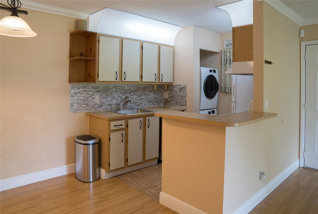 523 Trace Circle, Unit 106 Deerfield Beach, FL 33441 - Photo 12 of 26 a bathroom with a granite countertop sink and a mirror