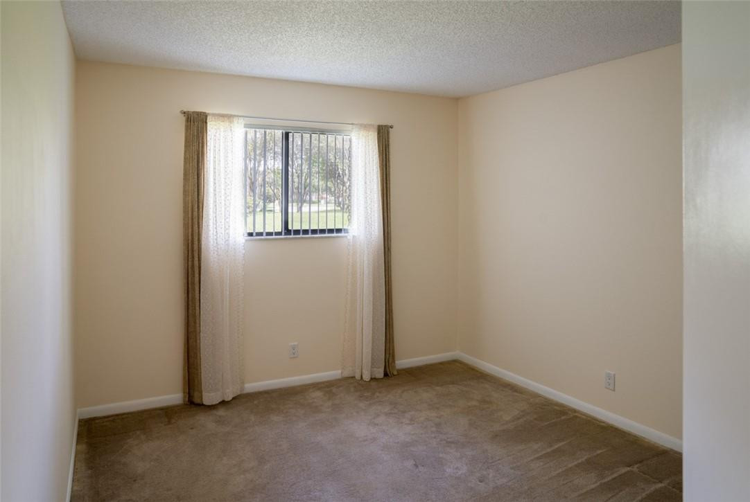 523 Trace Circle, Unit 106 Deerfield Beach, FL 33441 - Photo 22 of 26 an empty room with windows