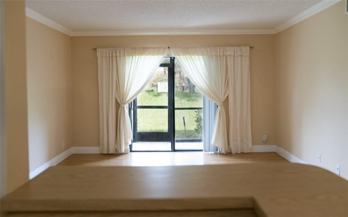 523 Trace Circle, Unit 106 Deerfield Beach, FL 33441 - Photo 7 of 26 a view of an empty room with a window