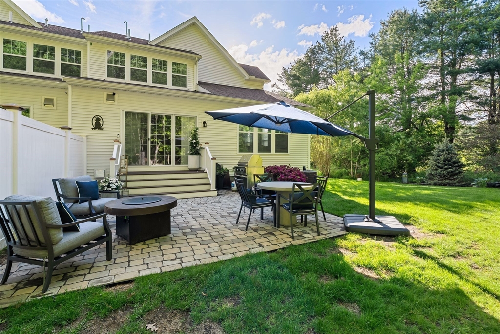 2 Hummingbird Way, Unit 1 Methuen, MA 01844 - Photo 34 of 42 a view of a house with backyard porch and sitting area