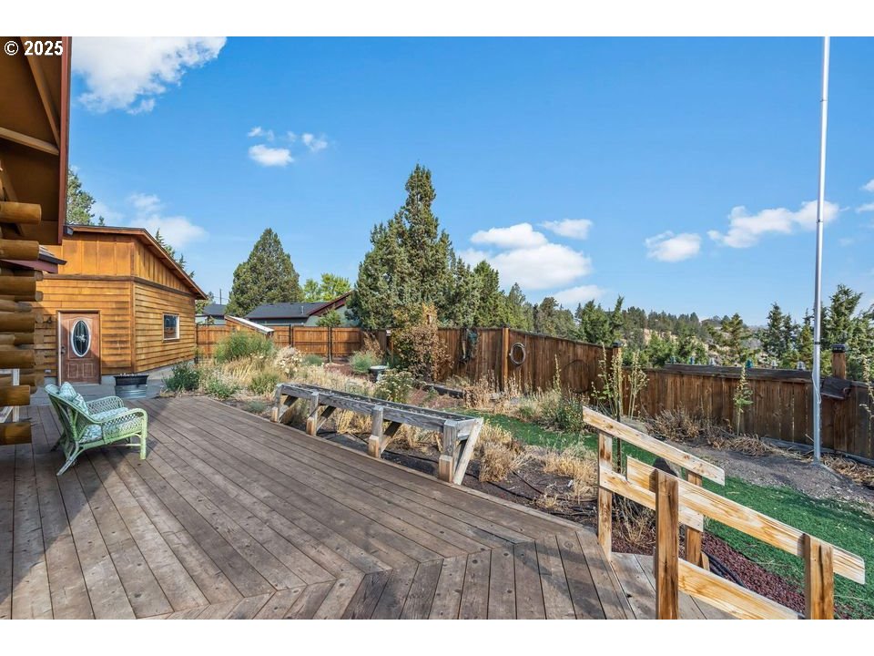 14515 Southwest Maverick Road Terrebonne, OR 97760 - Photo 14 of 39 a view of a lake with couches and wooden floor