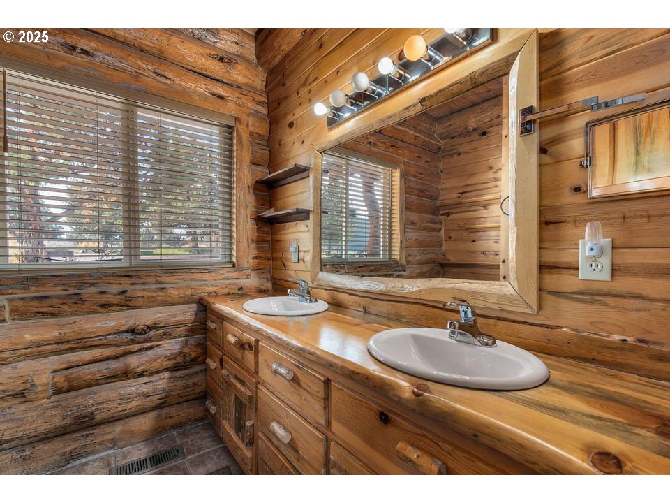 14515 Southwest Maverick Road Terrebonne, OR 97760 - Photo 2 of 39 a bathroom with a sink and a window