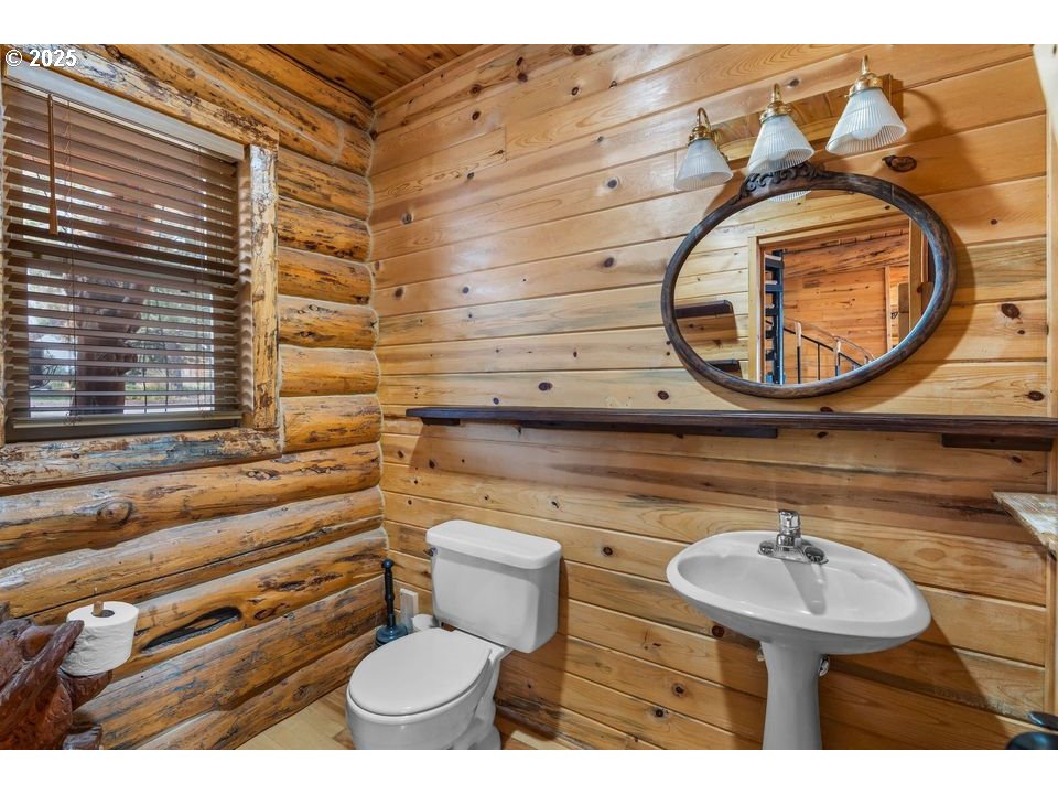 14515 Southwest Maverick Road Terrebonne, OR 97760 - Photo 4 of 39 a bathroom with a toilet sink and mirror