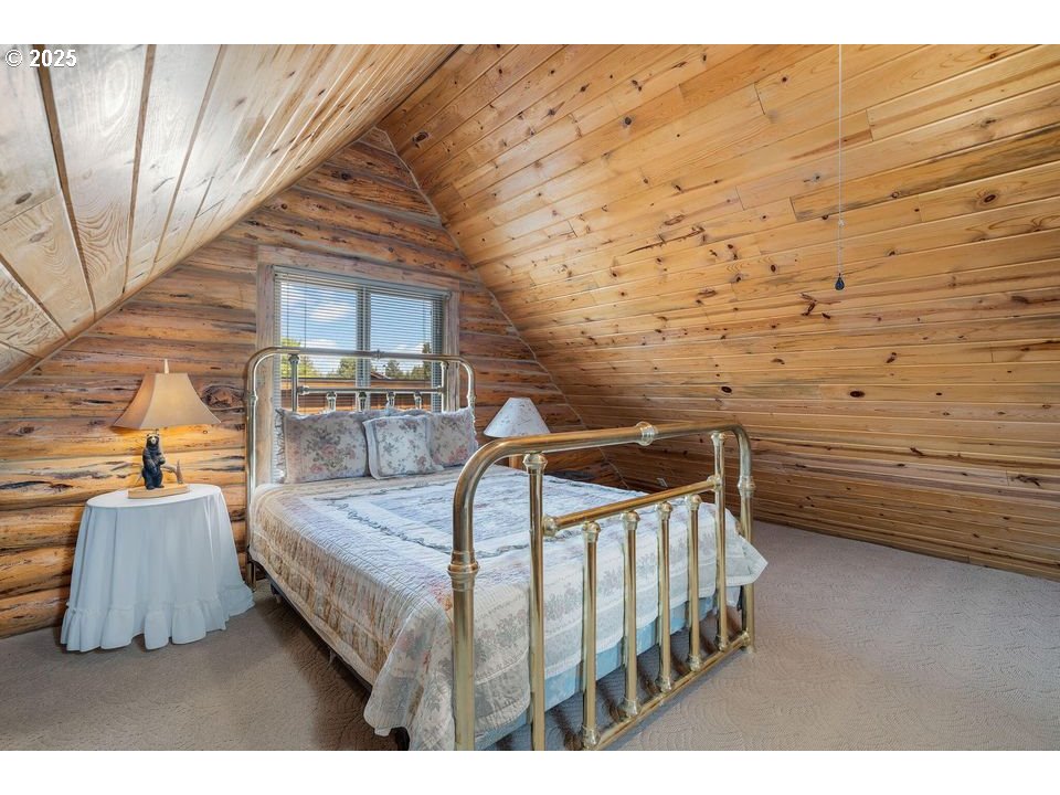 14515 Southwest Maverick Road Terrebonne, OR 97760 - Photo 7 of 39 a bedroom with furniture and a wooden floor