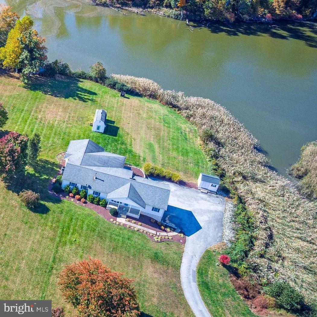 3349 Harris Road Townsend, DE 19734 - Photo 2 of 31 an aerial view of a house with a garden and lake view