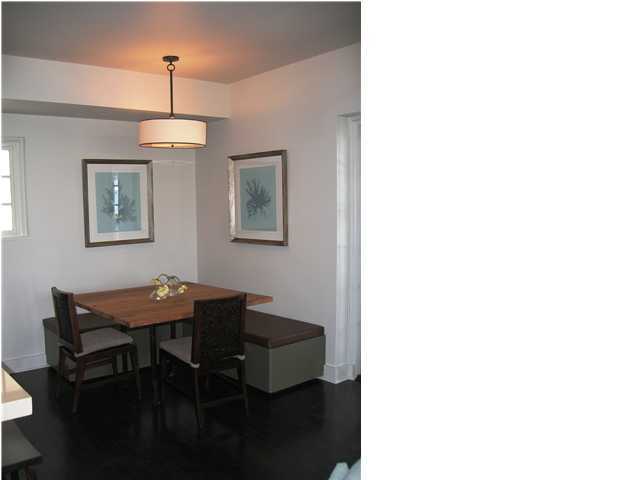 136 Unit Ave Inlet Beach, Unit 3B 1 Inlet Beach, FL 32461 - Photo 3 of 8 a dining room with a table and chairs