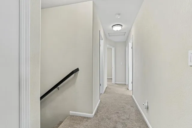 a view of a hallway with sliding door