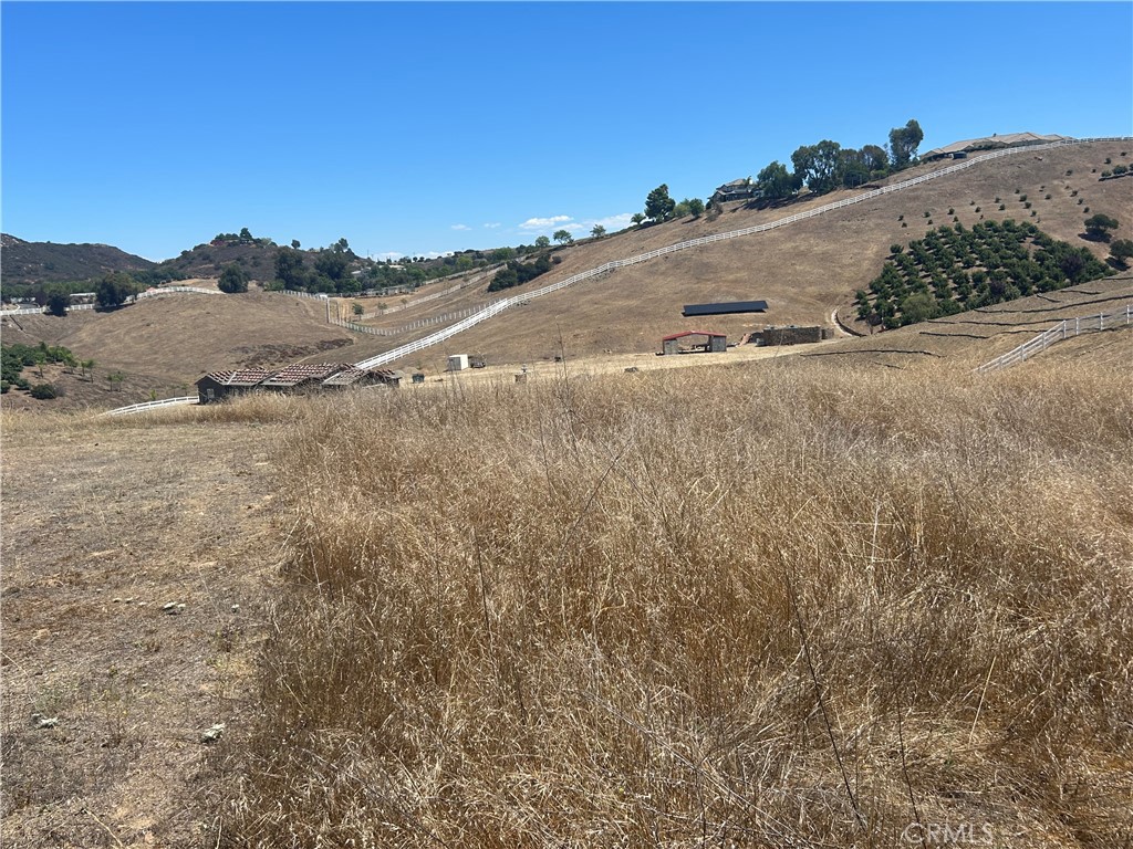 0 Vista Flora Road Murrieta, CA 92562 - Photo 17 of 52 a view of a dry field with mountains in the background