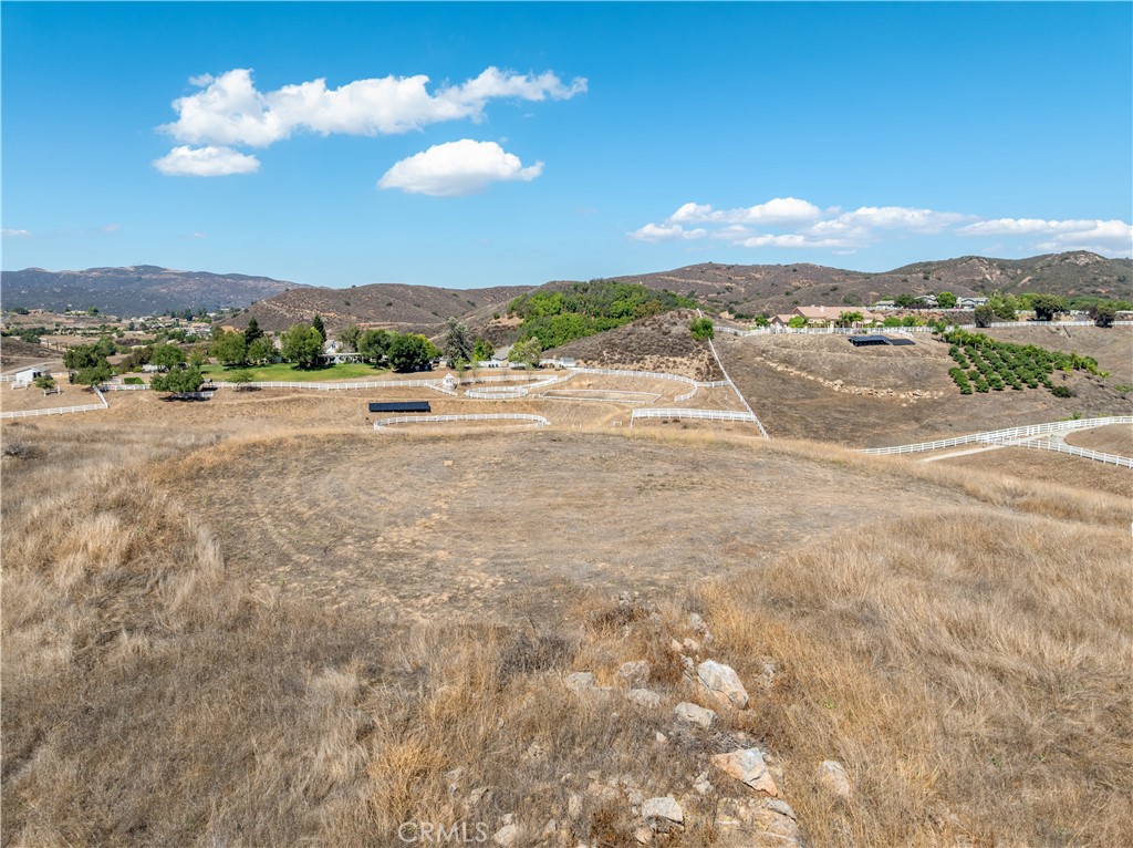 0 Vista Flora Road Murrieta, CA 92562 - Photo 44 of 52 a view of a lake with mountains in the background