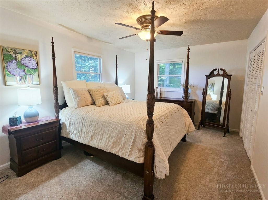 159 Easy Street Boone, NC 28607 - Photo 19 of 46 a bedroom with a bed dresser and a window