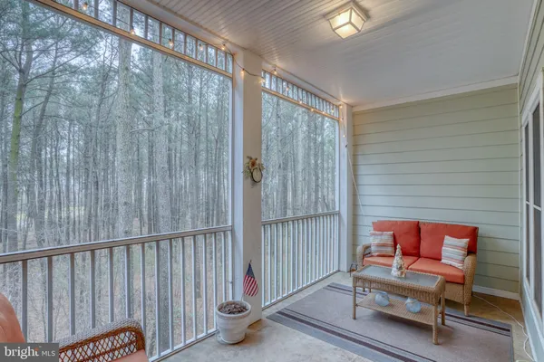 a bedroom with furniture and window