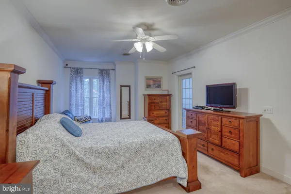 a bedroom with a bed and a television in it