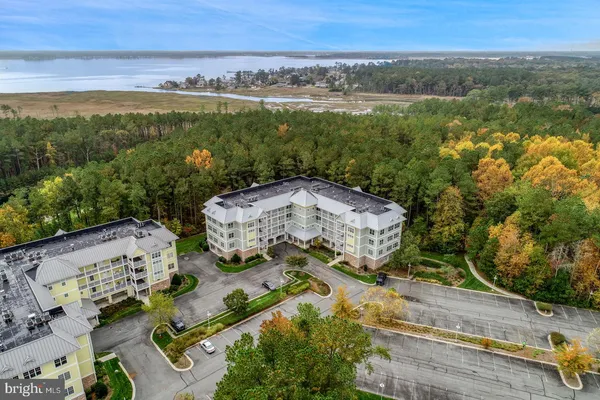an aerial view of a residential houses with outdoor space