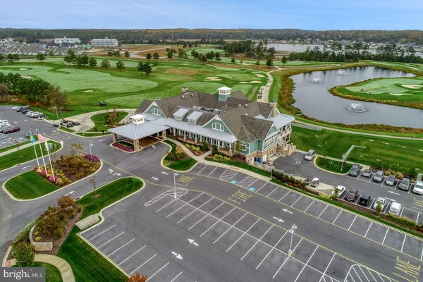 a view of a lake with a yard and outdoor seating