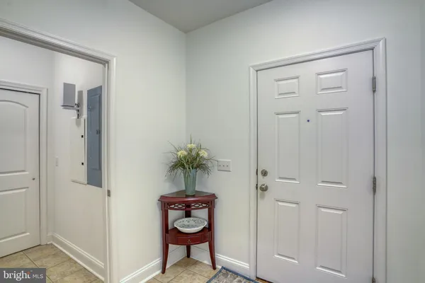 a view of a hallway with paintings on the wall