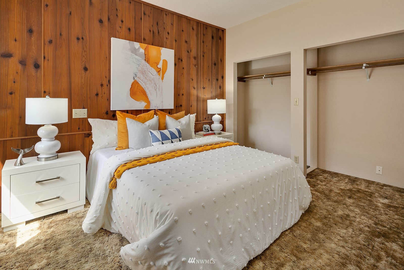 738 North 87th Street Seattle, WA 98103 - Photo 13 of 16 a bed room with a bed and a painting on the wall