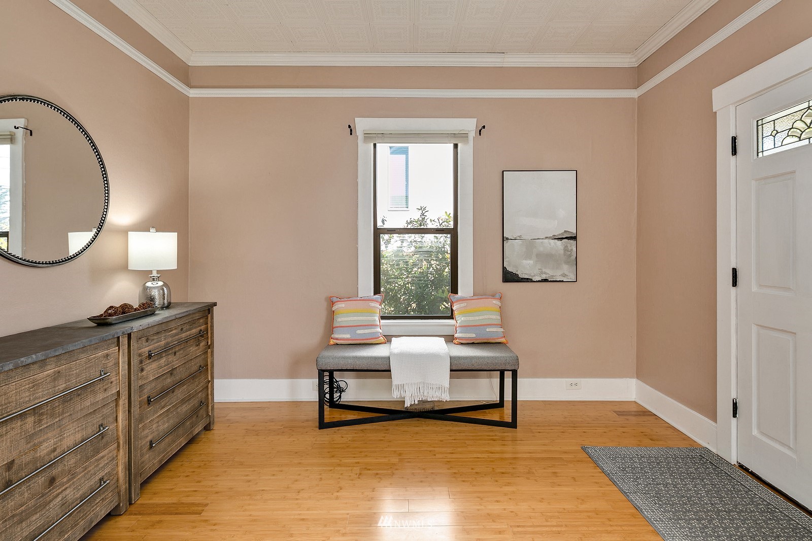 738 North 87th Street Seattle, WA 98103 - Photo 2 of 16 a living room with furniture a table and painting on the wall