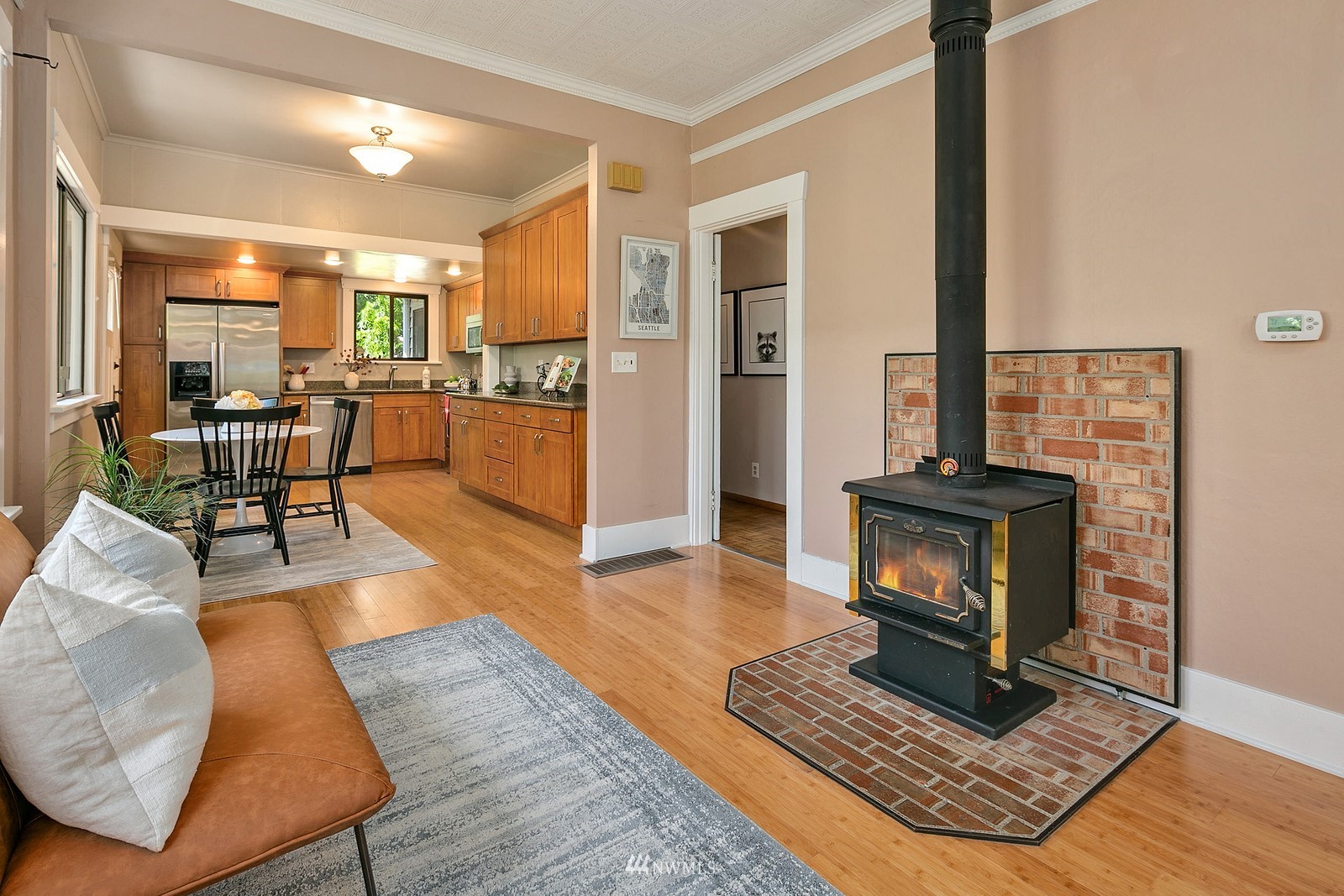 738 North 87th Street Seattle, WA 98103 - Photo 5 of 16 a living room with furniture a flat screen tv and a fireplace