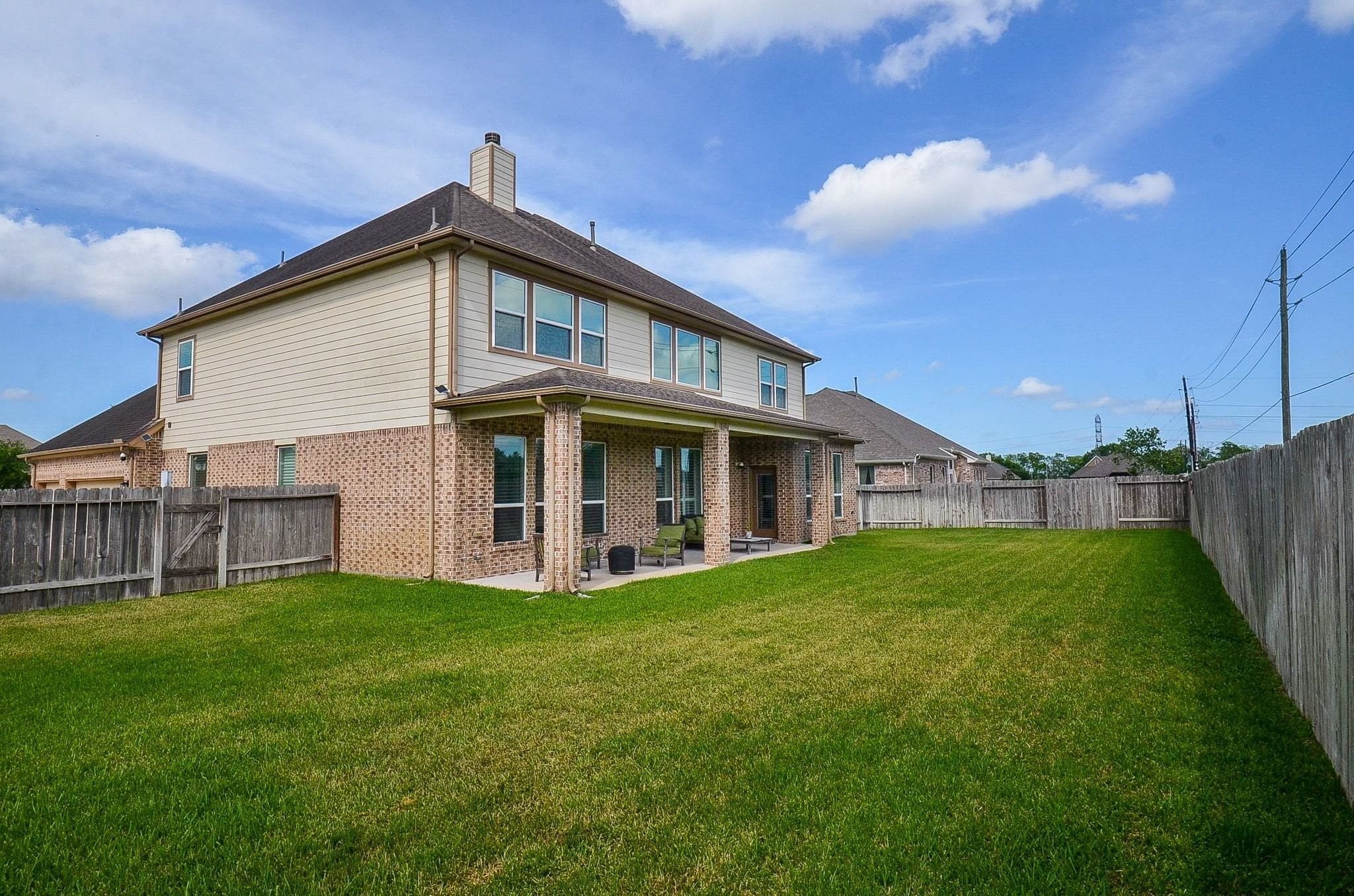 2714 Topaz Cove Lane Rosharon, TX 77583 - Photo 47 of 50 a view of a house with a yard and deck