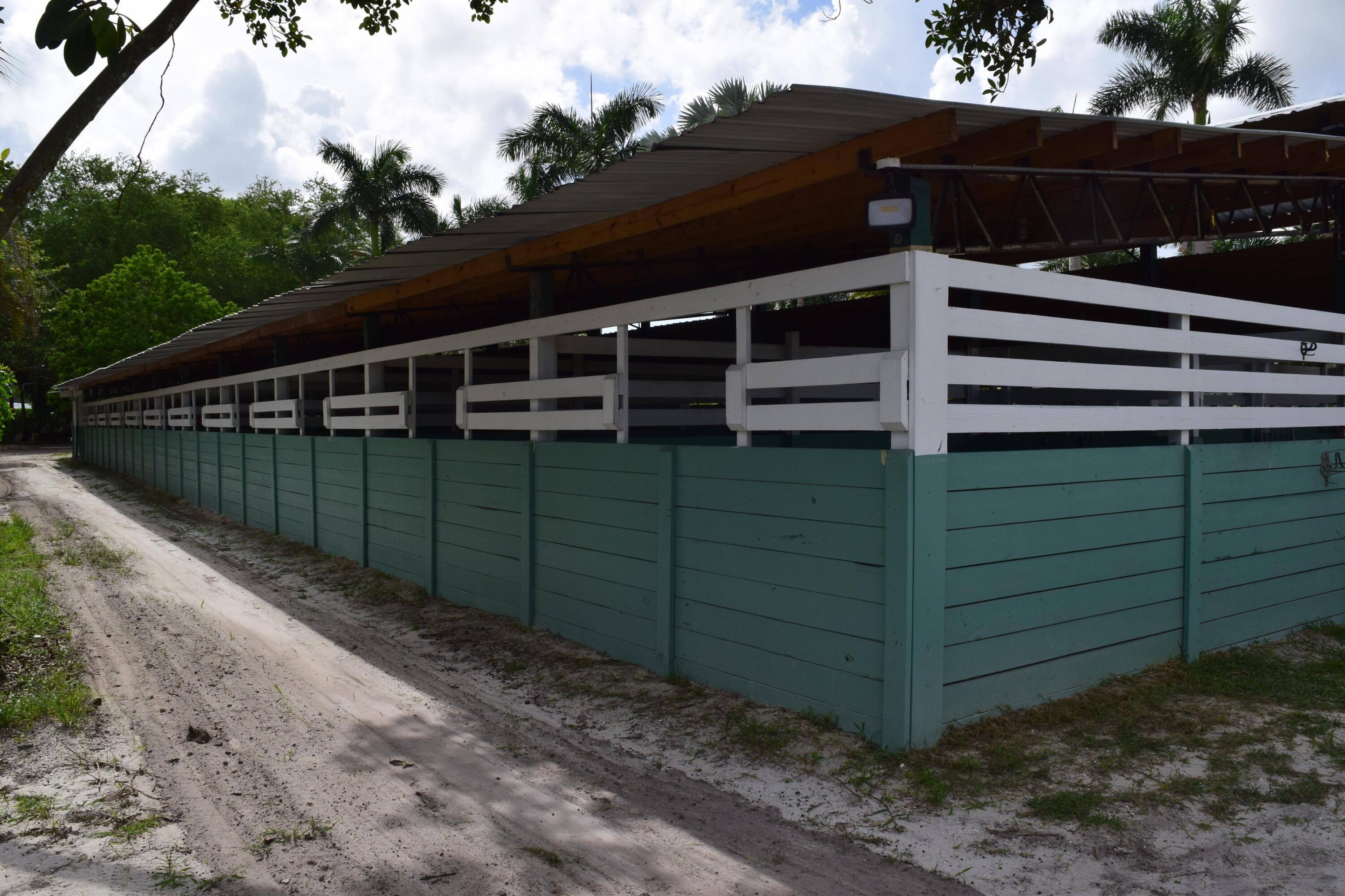 1100 D Road Loxahatchee Groves, FL 33470 - Photo 11 of 24 a view of a house with a yard