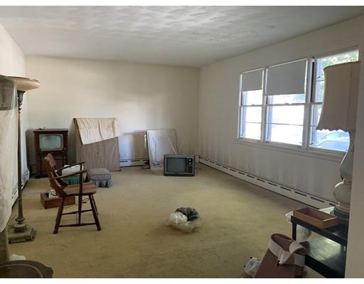4 Baker Road Everett, MA 02149 - Photo 4 of 11 a living room with furniture and a window
