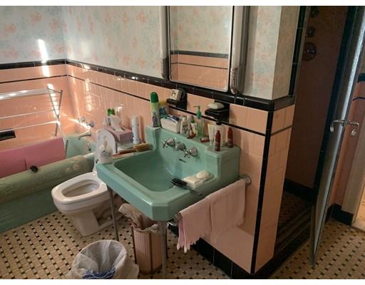4 Baker Road Everett, MA 02149 - Photo 8 of 11 a bathroom with a sink toilet and mirror